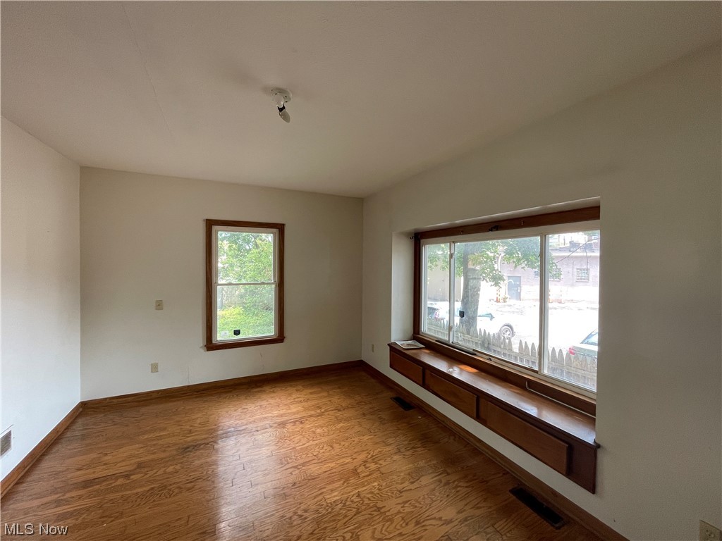 829 Berwin Street Akron, OH 44310 - Photo 7 of 24 Unfurnished room featuring wood-type flooring