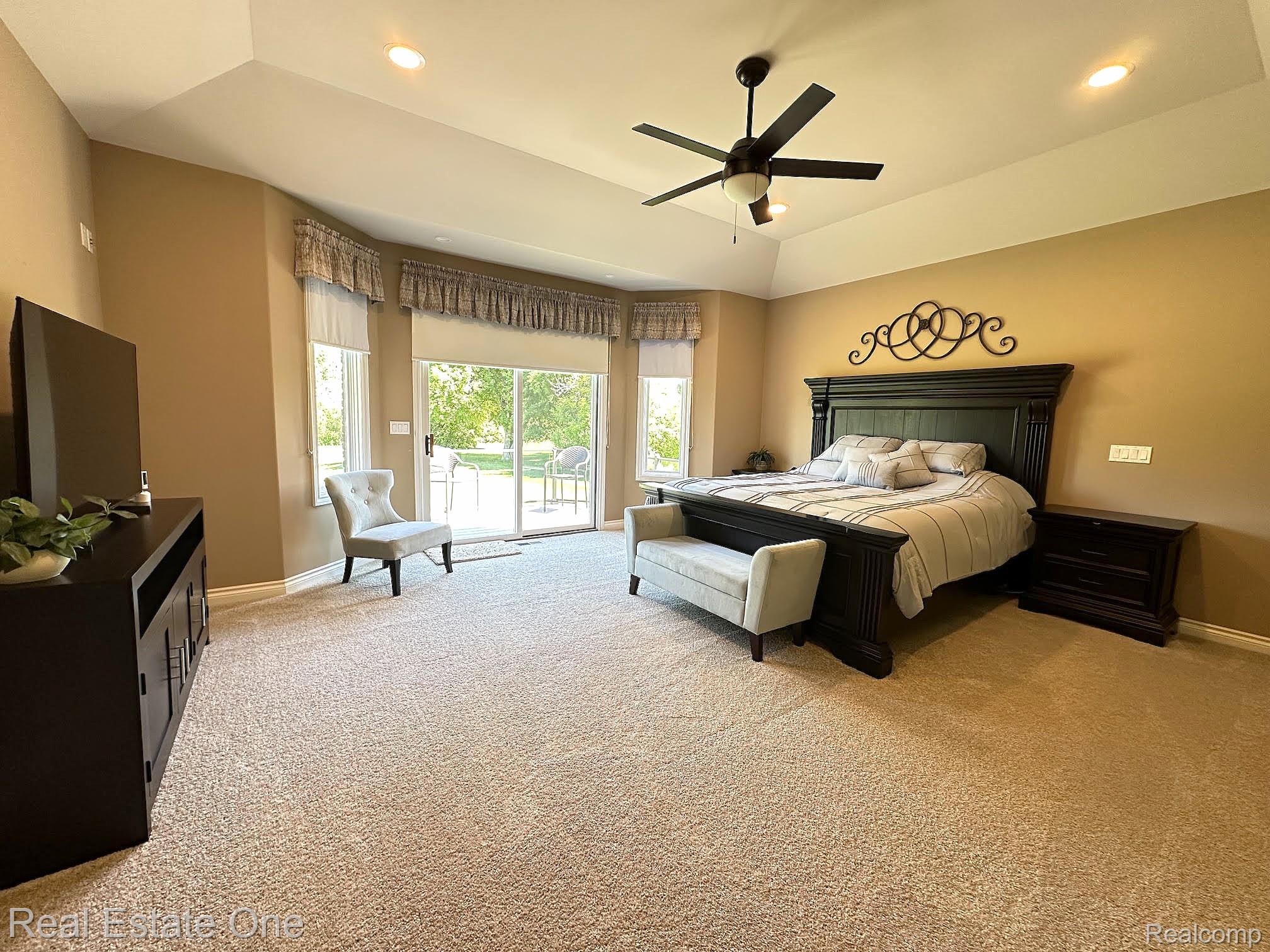 3648 West Tienken Road Rochester, MI 48306 - Photo 17 of 61 Primary Bedroom with Tray Ceiling, Fan and New Carpeting