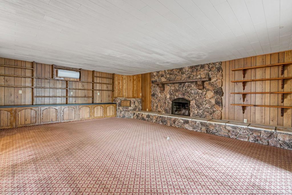1696 Bartram Way El Cajon, CA 92019 - Photo 11 of 35 a view of an empty room with a fireplace and a window