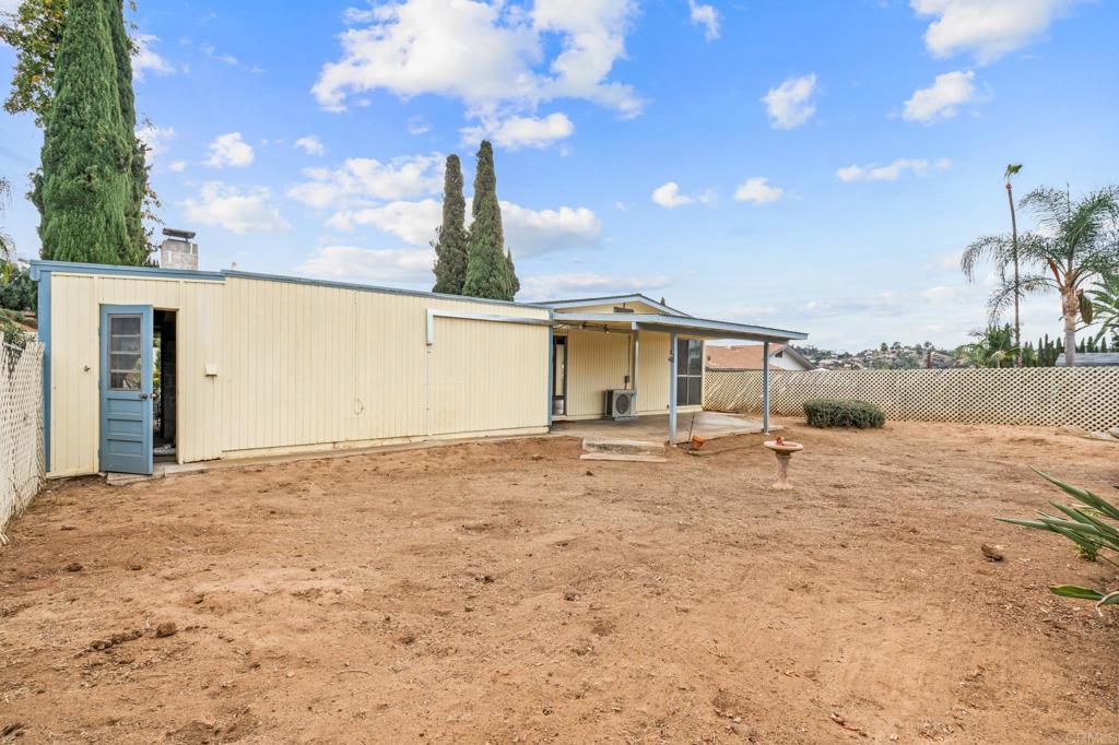 1696 Bartram Way El Cajon, CA 92019 - Photo 20 of 35 a backyard of a house with table and chairs