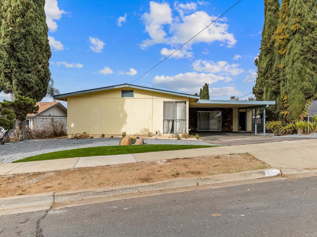 1696 Bartram Way El Cajon, CA 92019 - Photo 24 of 35 a front view of house with a garden