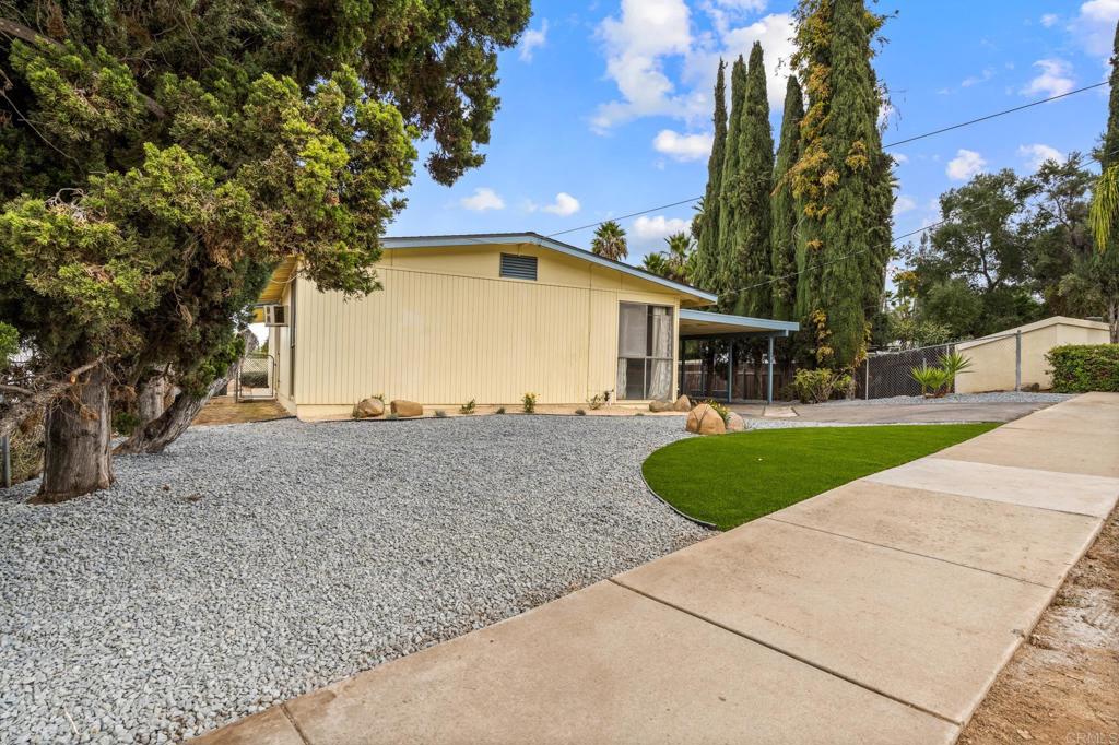 1696 Bartram Way El Cajon, CA 92019 - Photo 26 of 35 a front view of a house with a yard