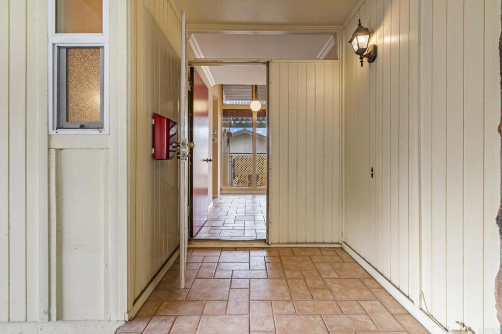1696 Bartram Way El Cajon, CA 92019 - Photo 3 of 35 a view of an entryway with a chandelier