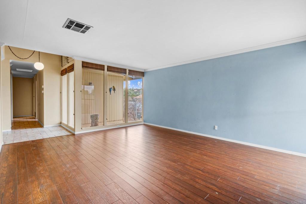 1696 Bartram Way El Cajon, CA 92019 - Photo 6 of 35 a view of an empty room with wooden floor