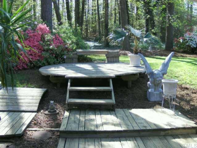120 Singleton Street Raleigh, NC 27606 - Photo 2 of 12 a view of a house with backyard water fountain and sitting area