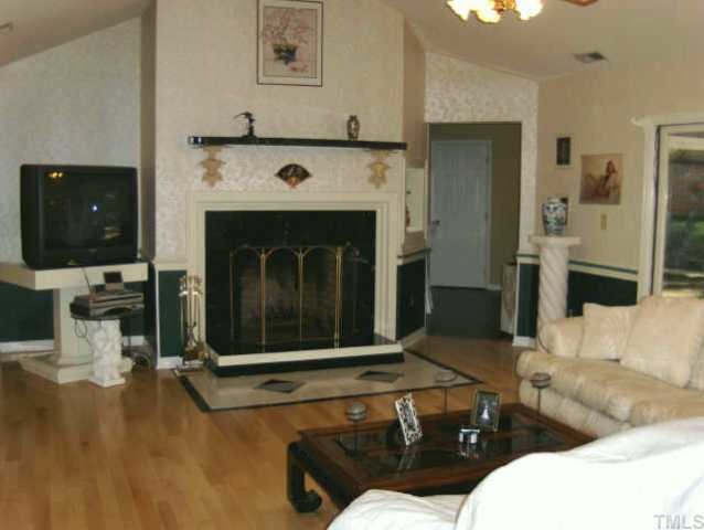 120 Singleton Street Raleigh, NC 27606 - Photo 3 of 12 a living room with furniture and a fireplace