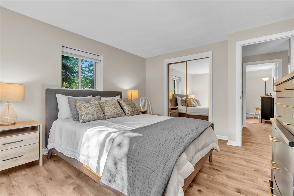 22 Bryon Road, Unit 1 Boston, MA 02467 - Photo 14 of 19 a bed room with a bed and furniture