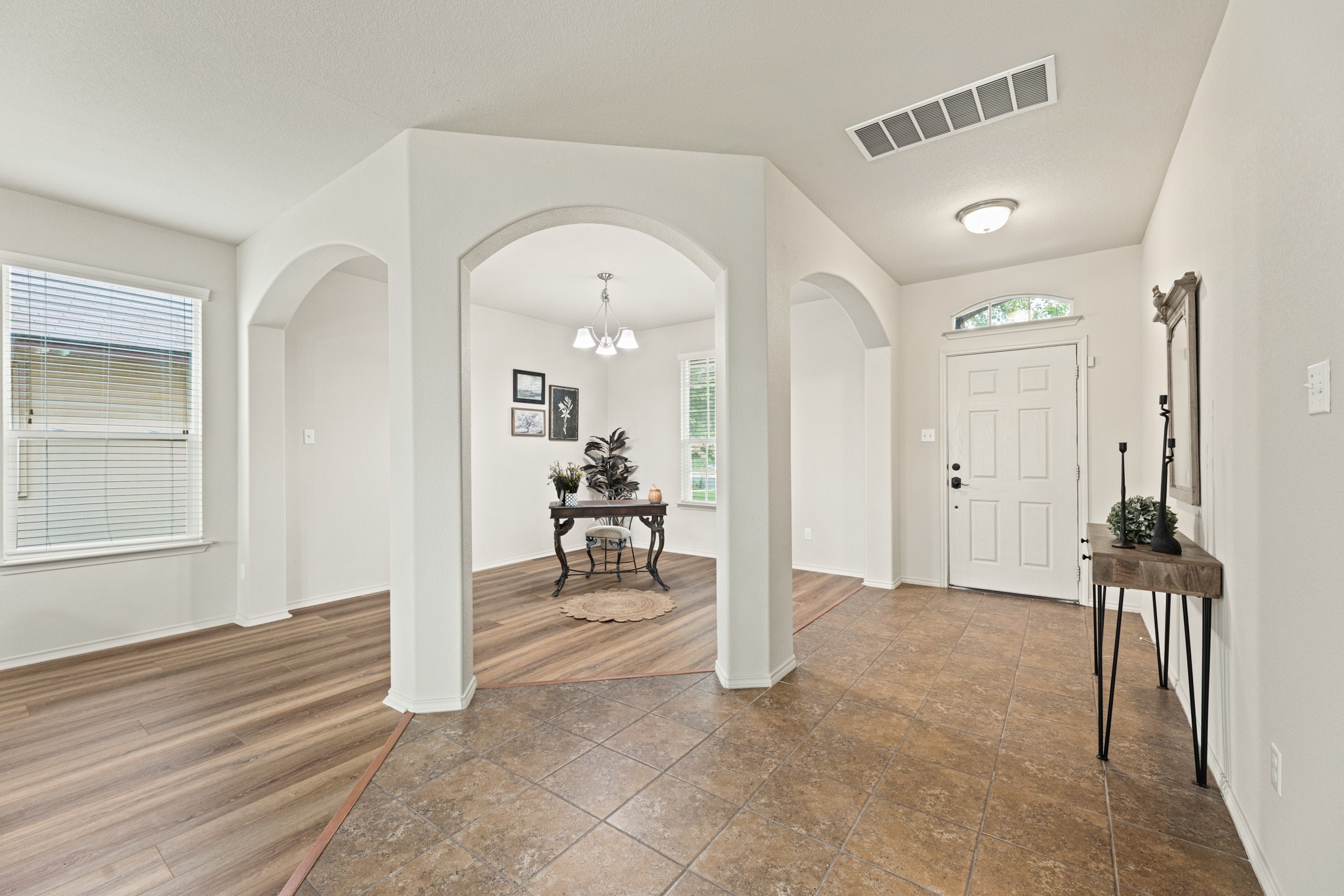 232 Geode Lane Jarrell, TX 76537 - Photo 2 of 39 Gorgeous architectural arched transitions connect the tiled entryway directly to the adjoining rooms.