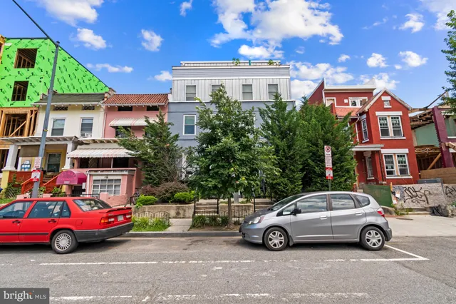 a car parked in front of a house
