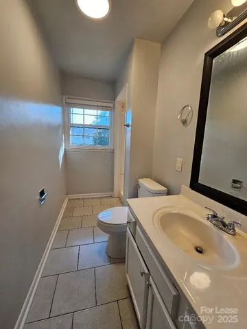 a bathroom with a sink a toilet and tub