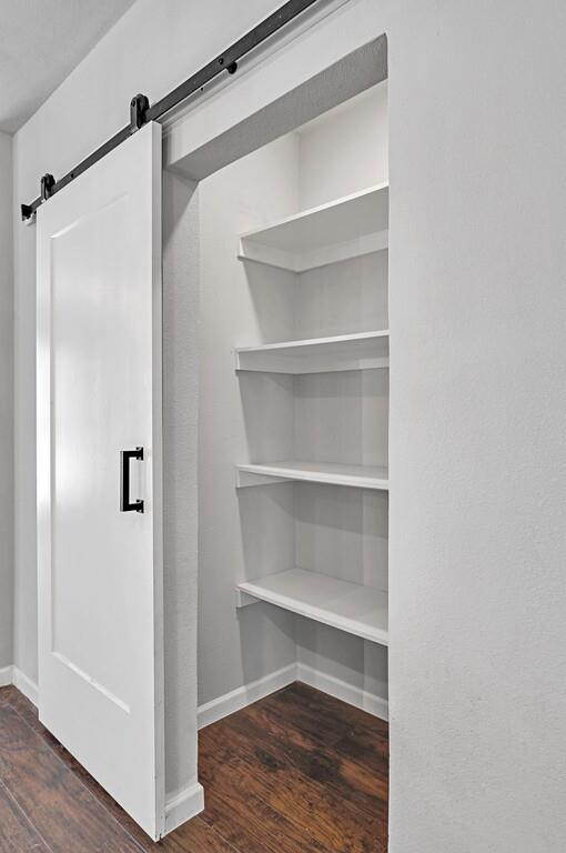 2001 Colcord Avenue Waco, TX 76707 - Photo 12 of 27 a view of walk in closet with empty racks