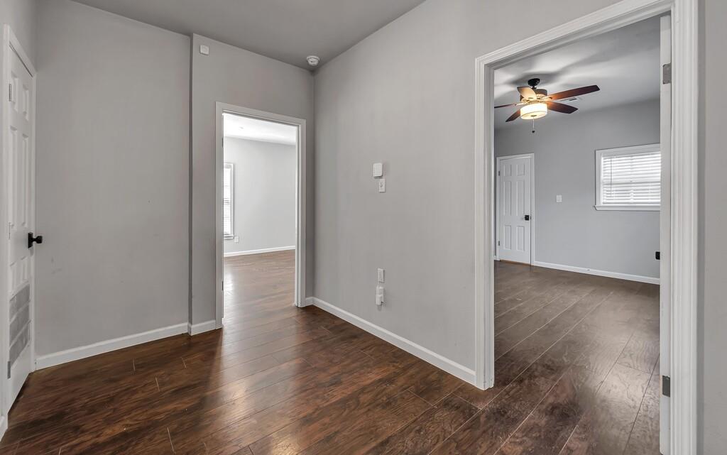 2001 Colcord Avenue Waco, TX 76707 - Photo 14 of 27 wooden floor in an empty room with a window