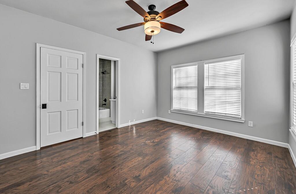 2001 Colcord Avenue Waco, TX 76707 - Photo 23 of 27 a view of an empty room with wooden floor and a window
