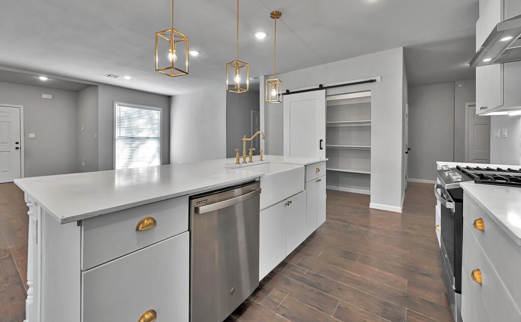 2001 Colcord Avenue Waco, TX 76707 - Photo 10 of 27 a kitchen with kitchen island a counter top space appliances and a center island
