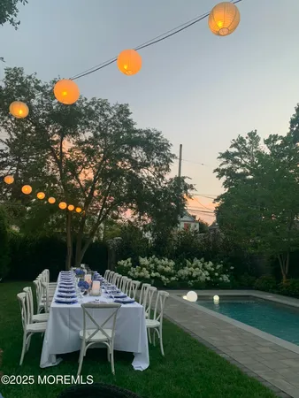 a table and chairs sitting in the middle of a house