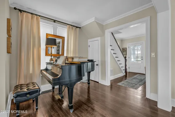 a view of a livingroom with furniture and wooden floor
