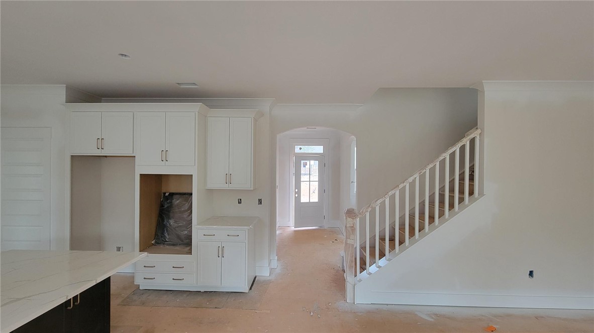 533 16th Circle Walhalla, SC 29691 - Photo 4 of 28 This bright and open space features a contemporary kitchen and elegant staircase, ready for your personal touch.