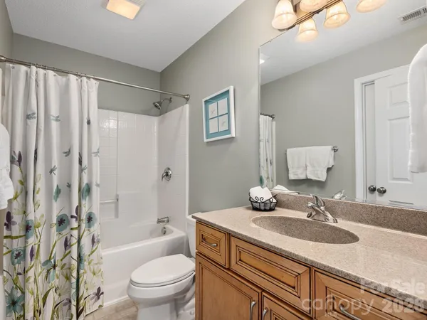 a bedroom with a bed and a table with chair