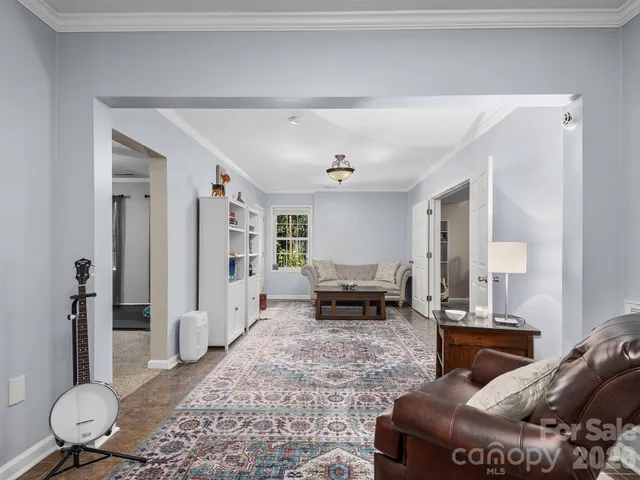 a living room with furniture and a table