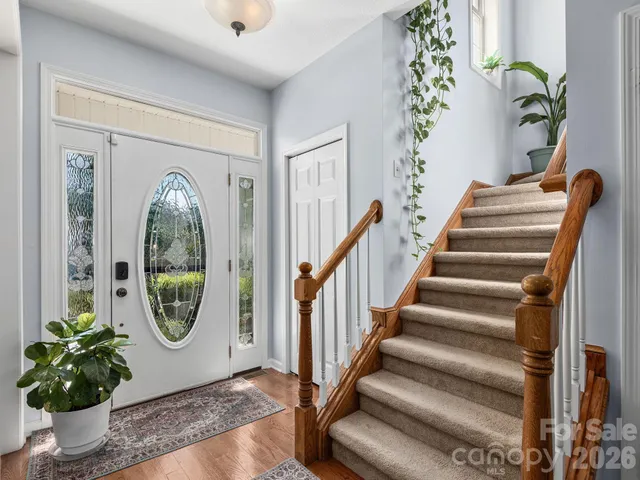 a view of an entryway with wooden floor