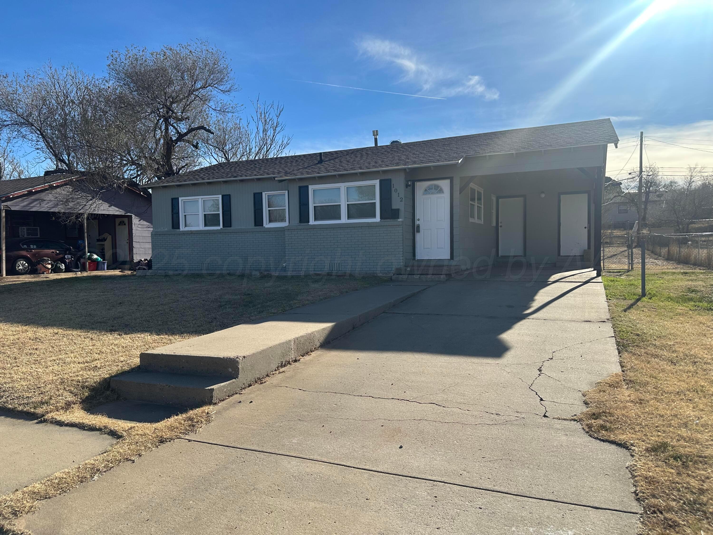 1012 Harper Street Amarillo, TX 79107 - Photo 20 of 24 a front view of a house with yard