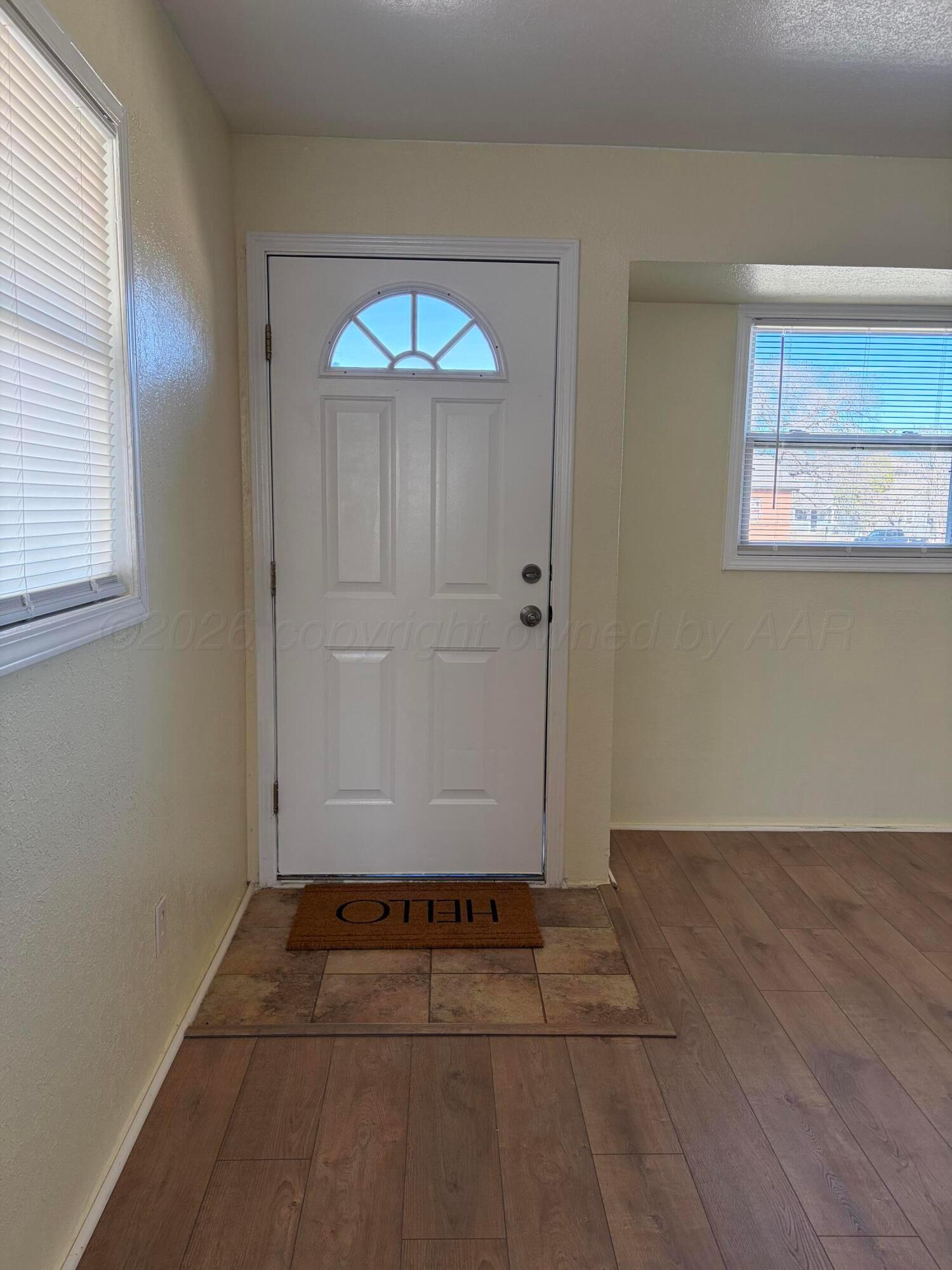 1012 Harper Street Amarillo, TX 79107 - Photo 3 of 24 an empty room with windows and closet