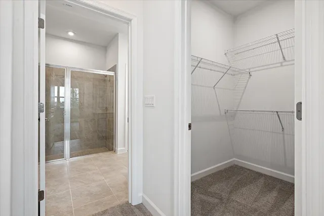 a bathroom with a glass shower door