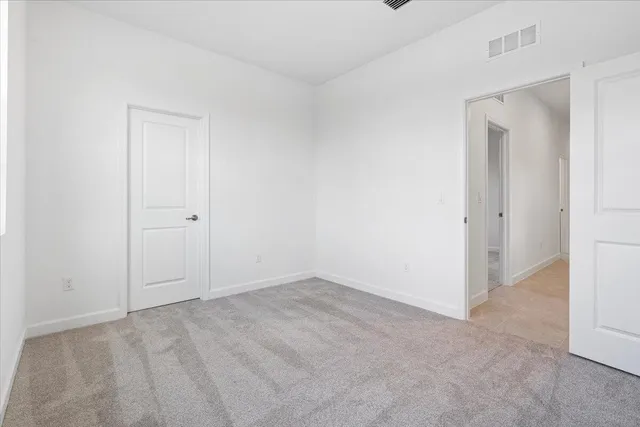 an empty room with closet area