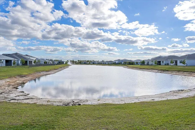 a view of a lake with a big yard