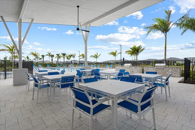 a living room with couches a coffee table and a large window