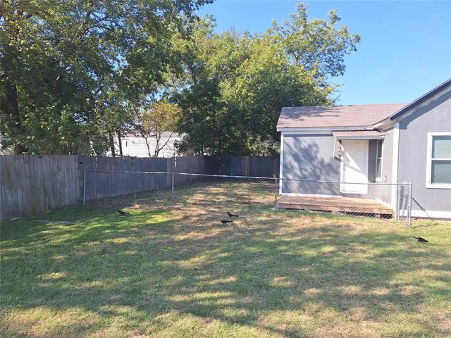a swimming pool with wooden fence
