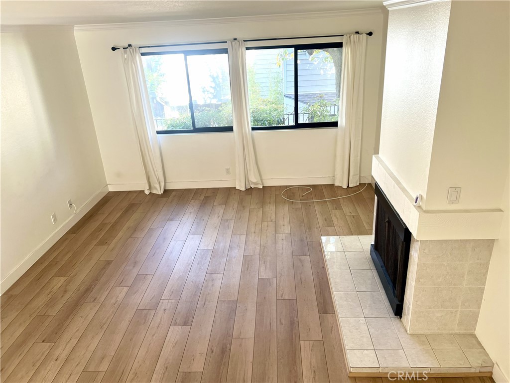 4 Latitude Court Newport Beach, CA 92663 - Photo 14 of 41 a view of an empty room with wooden floor and a window