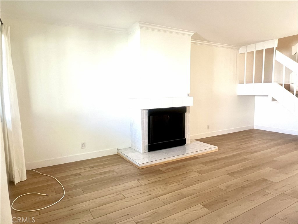 4 Latitude Court Newport Beach, CA 92663 - Photo 15 of 41 a view of an empty room with wooden floor