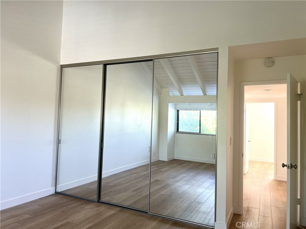 4 Latitude Court Newport Beach, CA 92663 - Photo 23 of 41 a view of an empty room with wooden floor and a window
