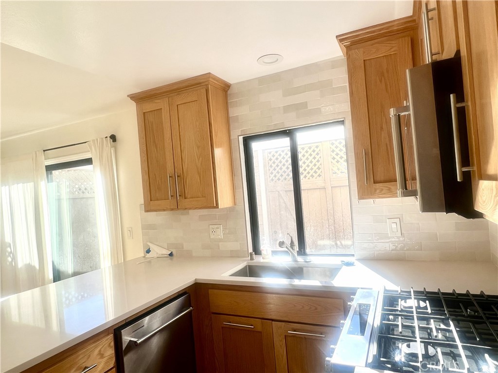 4 Latitude Court Newport Beach, CA 92663 - Photo 3 of 41 a kitchen with a sink and a window