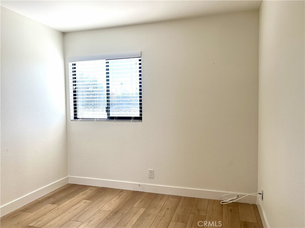 4 Latitude Court Newport Beach, CA 92663 - Photo 33 of 41 a view of an empty room with wooden floor and a window