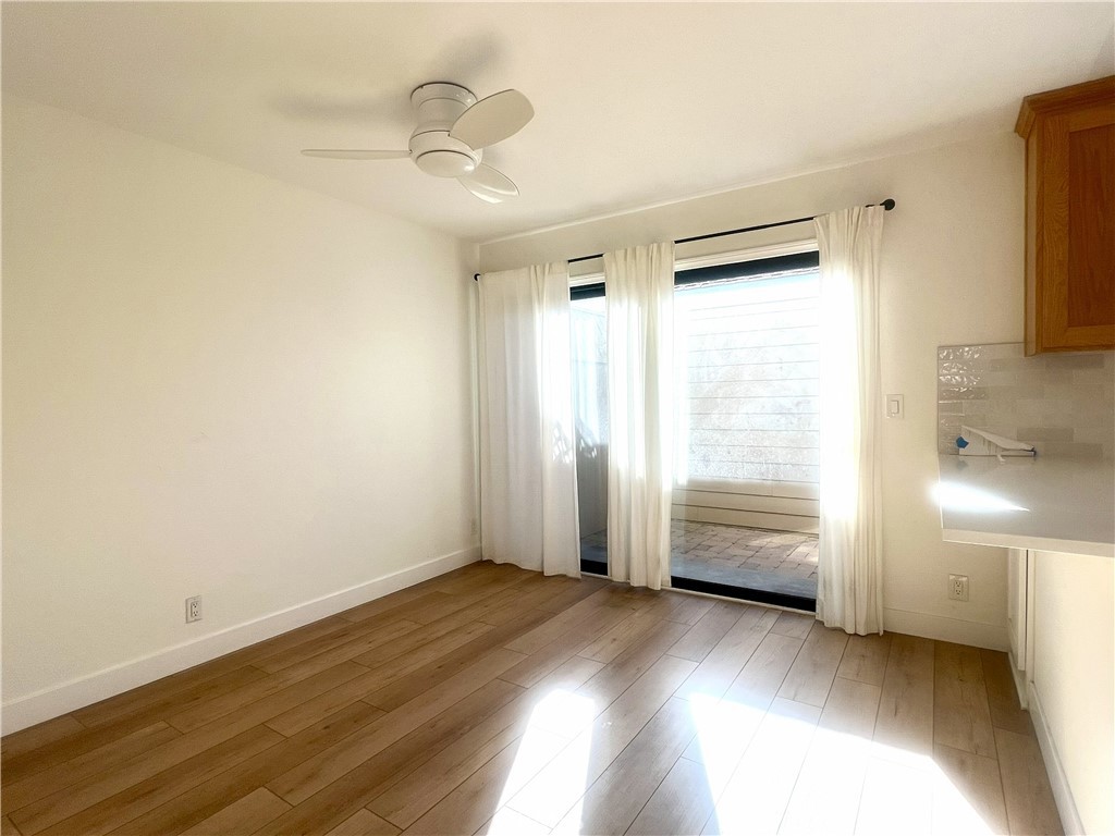 4 Latitude Court Newport Beach, CA 92663 - Photo 8 of 41 a view of empty room with wooden floor and fan
