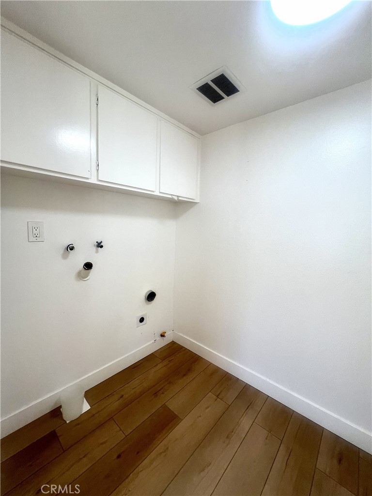 4 Latitude Court Newport Beach, CA 92663 - Photo 9 of 41 a view of a room with wooden floor