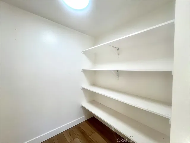 a bathroom with a sink toilet and mirror
