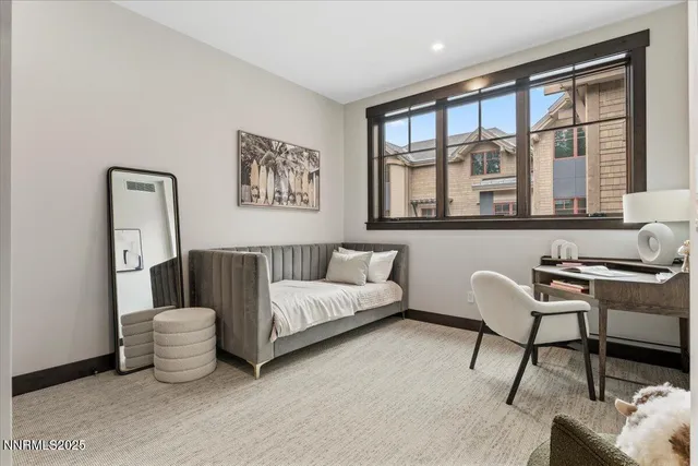 a spacious bedroom with a bed and a window