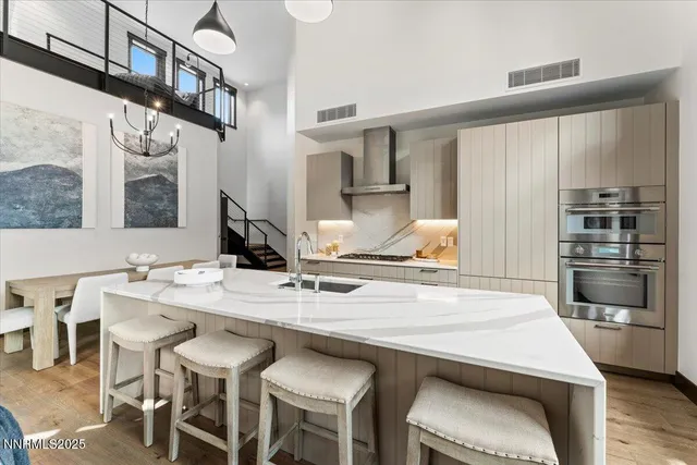 a kitchen with a table and chairs in it