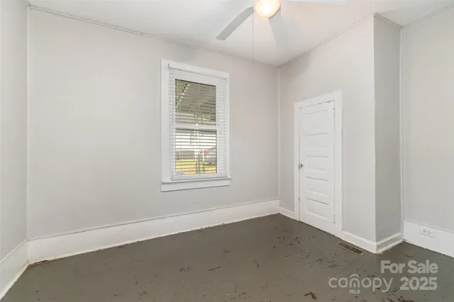 an empty room with windows