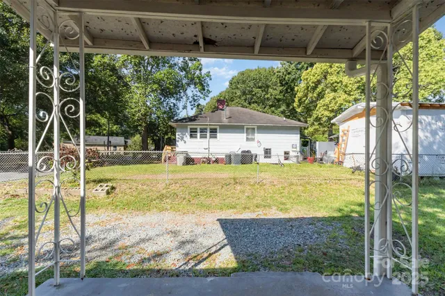 a view of a house with backyard from a patio