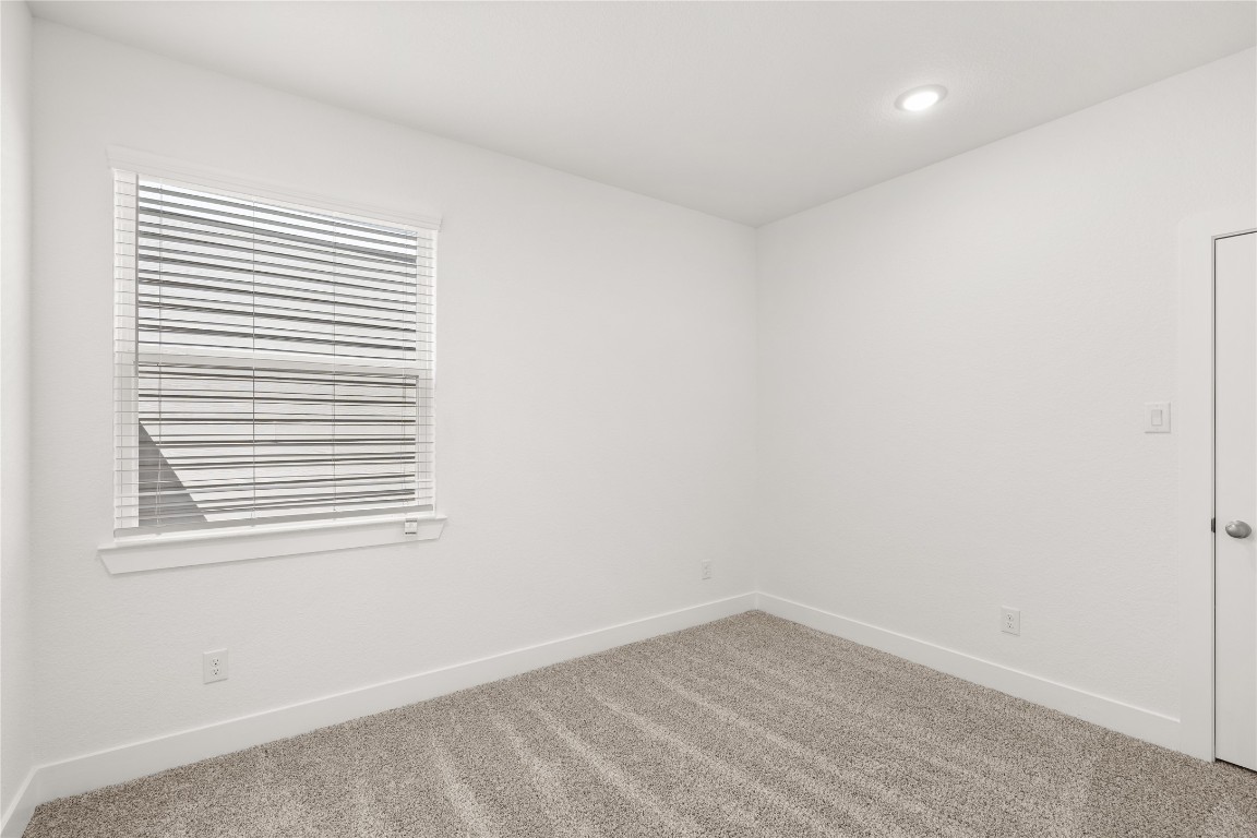 520 Red Cascade Trail Willis, TX 77318 - Photo 12 of 27 an empty room with a window