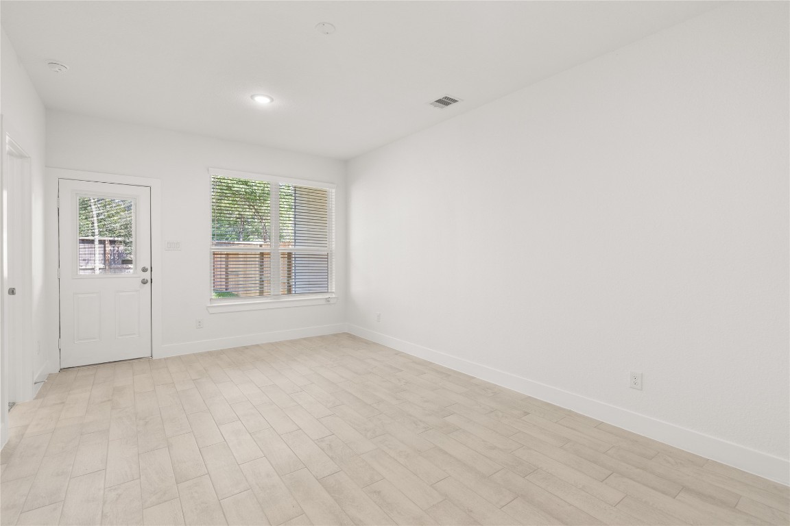 520 Red Cascade Trail Willis, TX 77318 - Photo 15 of 27 an empty room with windows