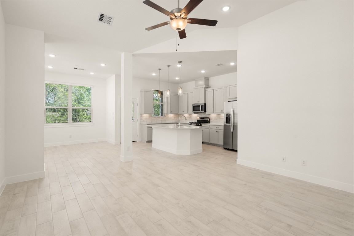 520 Red Cascade Trail Willis, TX 77318 - Photo 5 of 27 a view of a kitchen with a sink and a window