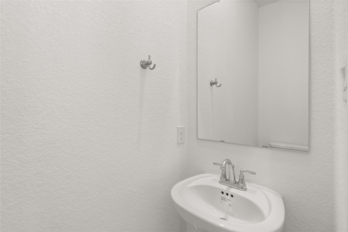 520 Red Cascade Trail Willis, TX 77318 - Photo 6 of 27 a bathroom with a sink and a mirror