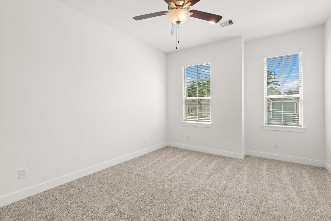 520 Red Cascade Trail Willis, TX 77318 - Photo 7 of 27 an empty room with a window