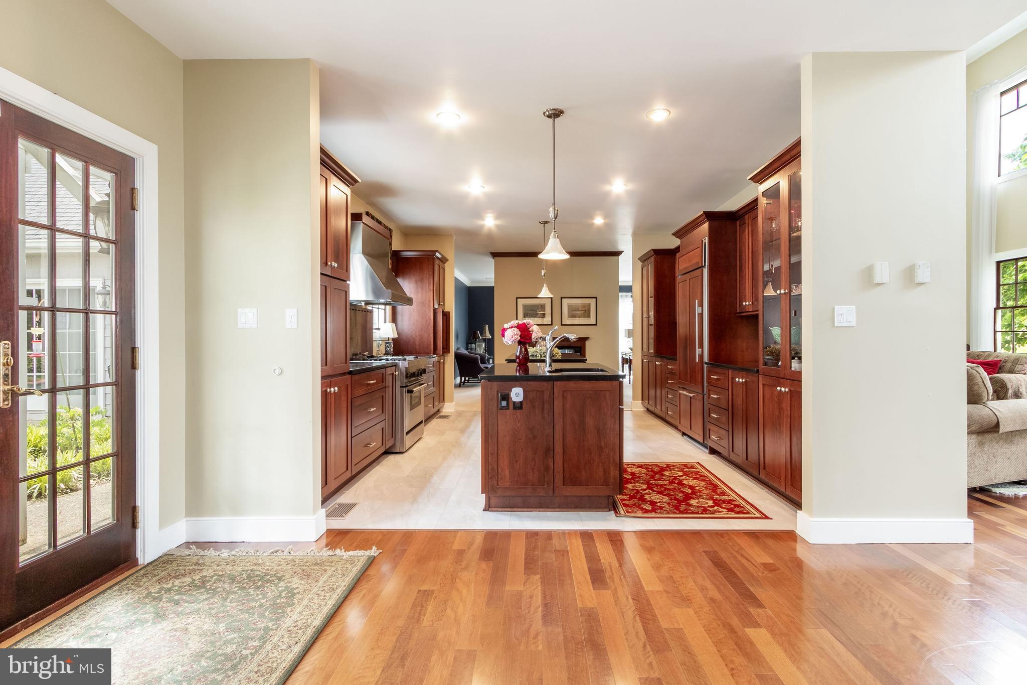 80 Linvale Road Ringoes, NJ 08551 - Photo 14 of 47 a view of a kitchen with kitchen island granite countertop wooden floor and stainless steel appliances