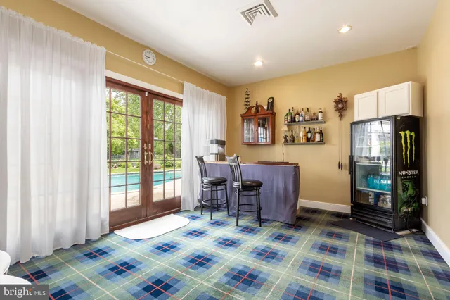 a bedroom that has a bed and a table in it